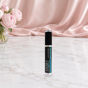 Luma Lips plumping lip gloss on a vanity